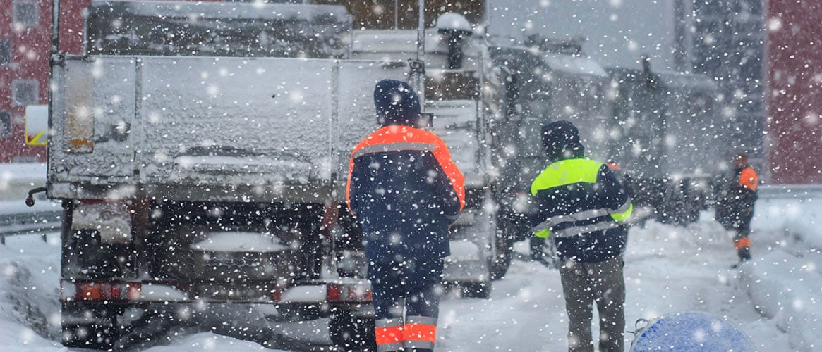 highway workers in the snow